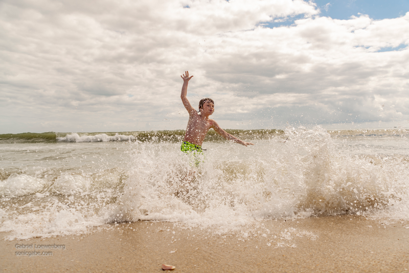 I was talking to this guy we met (who’s family set up next to us) while taking pictures of the crashing waves. His son ran through the shot and it couldn’t have been more perfect.